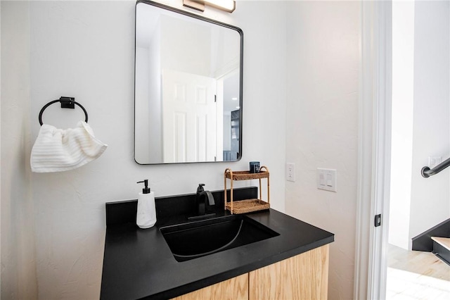 bathroom featuring vanity and wood-type flooring