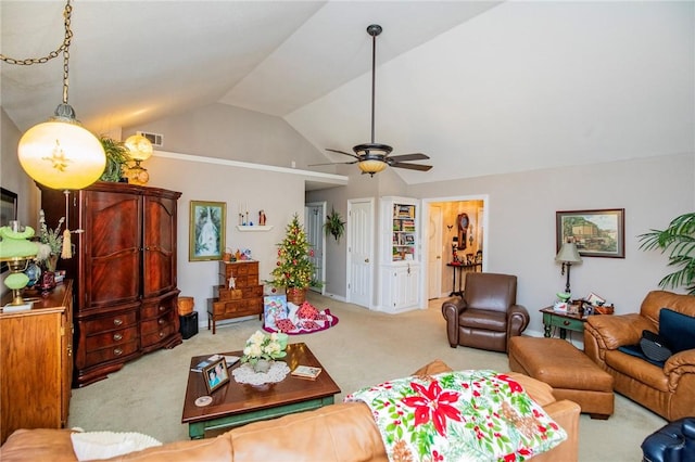 living room with ceiling fan, light colored carpet, and vaulted ceiling