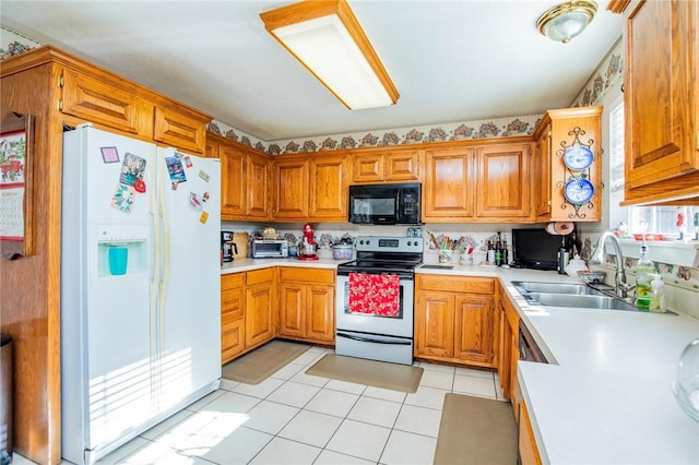 kitchen featuring electric stove, sink, light tile patterned flooring, and white refrigerator with ice dispenser