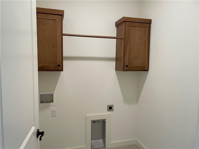 laundry room featuring cabinets, washer hookup, and electric dryer hookup