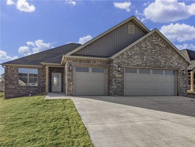 view of front of home with a garage and a front yard