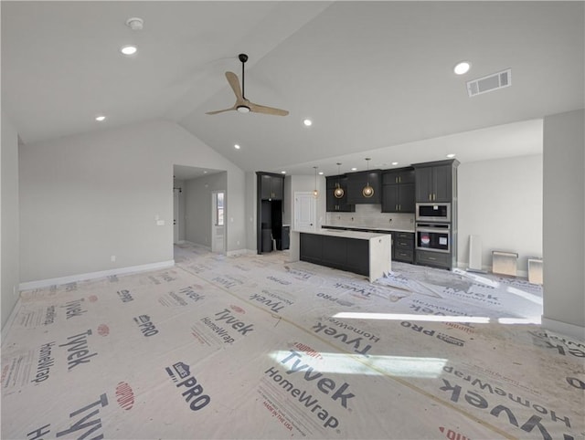 carpeted living room with ceiling fan and lofted ceiling