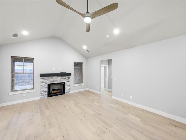 unfurnished living room featuring vaulted ceiling, ceiling fan, and light hardwood / wood-style floors