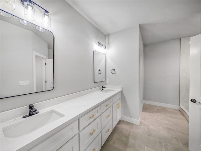 bathroom featuring tile patterned flooring and vanity