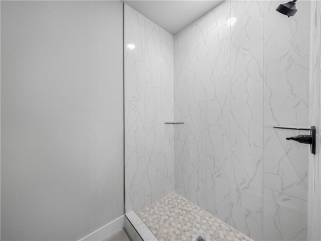 bathroom with a tile shower