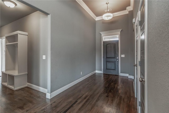 entryway with crown molding and dark hardwood / wood-style flooring