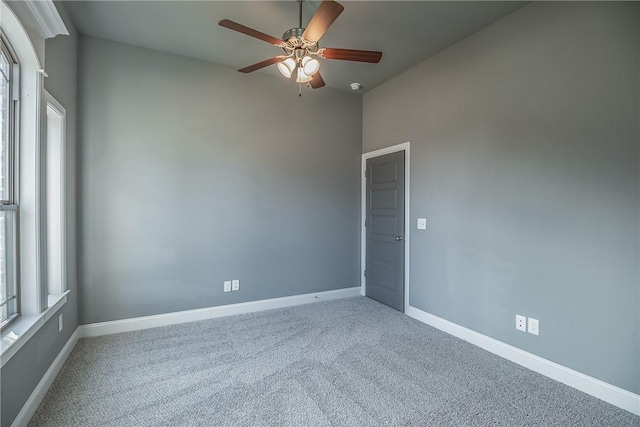 unfurnished room featuring carpet flooring and ceiling fan