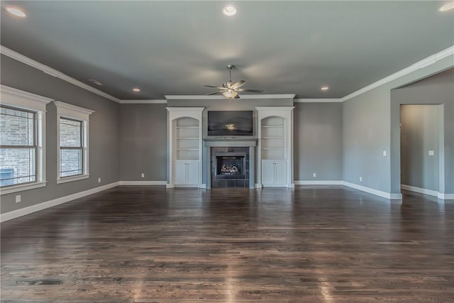 unfurnished living room featuring ceiling fan, dark hardwood / wood-style flooring, and crown molding