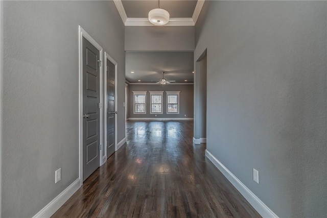 hall featuring dark wood-type flooring and ornamental molding