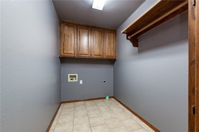 clothes washing area featuring cabinets, washer hookup, and electric dryer hookup