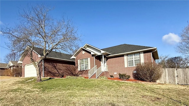 view of front facade featuring a garage and a front lawn