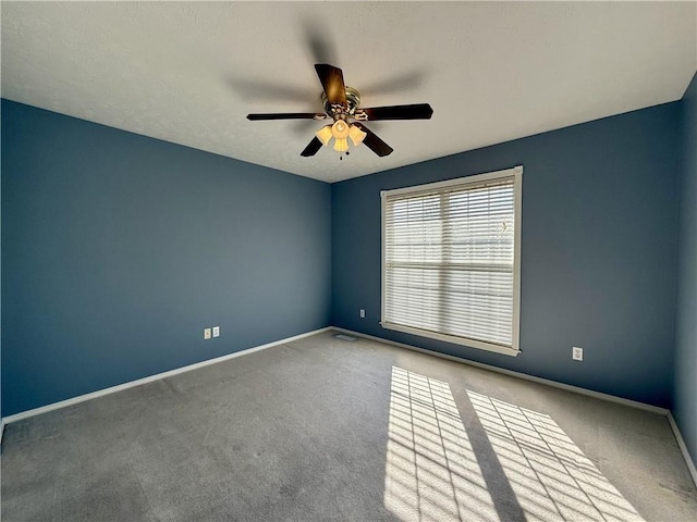 unfurnished room featuring light colored carpet and ceiling fan