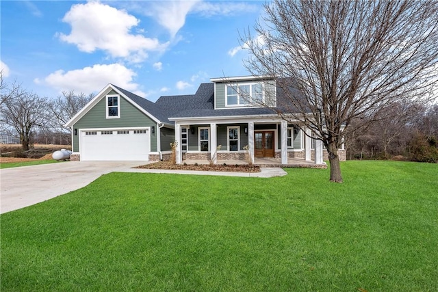 view of front of house with french doors, a porch, concrete driveway, a garage, and a front lawn