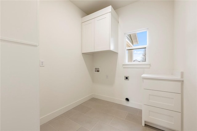 washroom with cabinet space, light tile patterned floors, baseboards, hookup for an electric dryer, and washer hookup