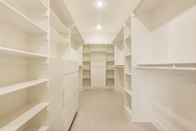 walk in closet featuring light tile patterned floors