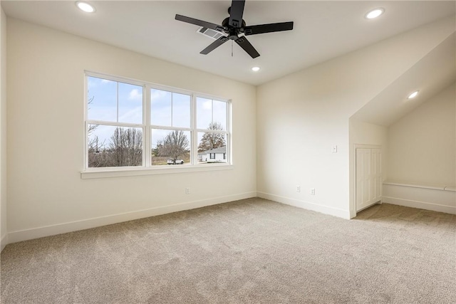 empty room featuring baseboards, recessed lighting, and light colored carpet