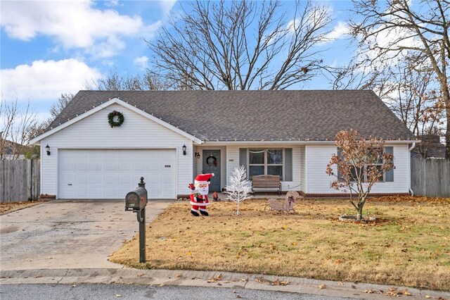 ranch-style home with a front yard and a garage