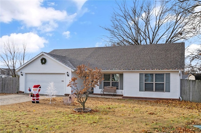 single story home with a front yard and a garage