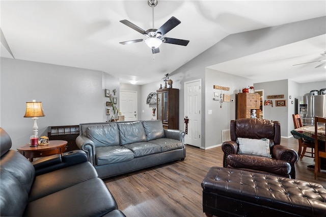 living room with wood-type flooring, lofted ceiling, and ceiling fan