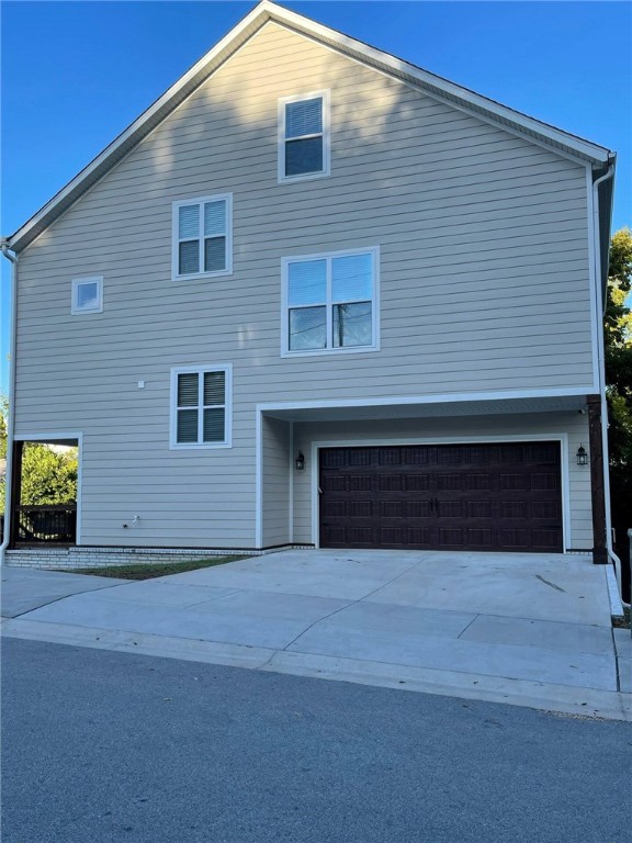 view of property exterior with a garage