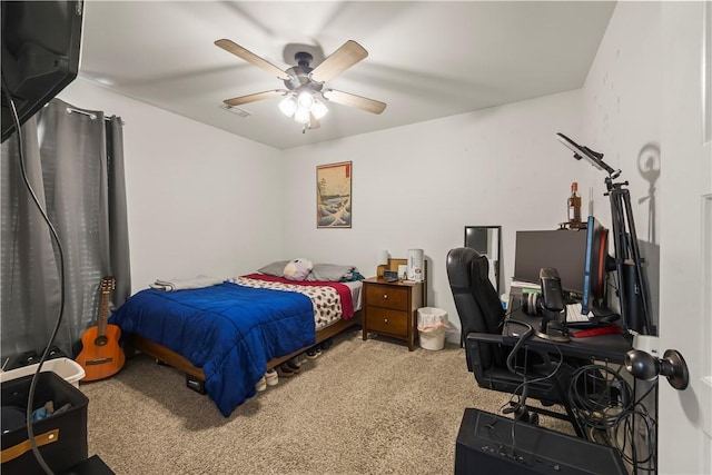 bedroom with ceiling fan and carpet floors