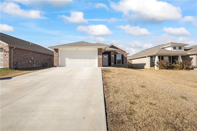 view of front of house with a front lawn and a garage