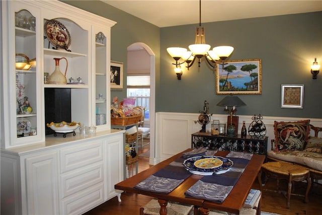 dining area with a chandelier and dark hardwood / wood-style floors