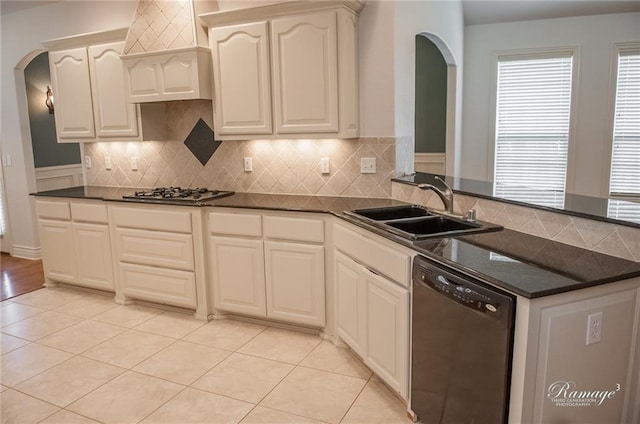 kitchen with dishwasher, backsplash, stainless steel gas cooktop, and sink