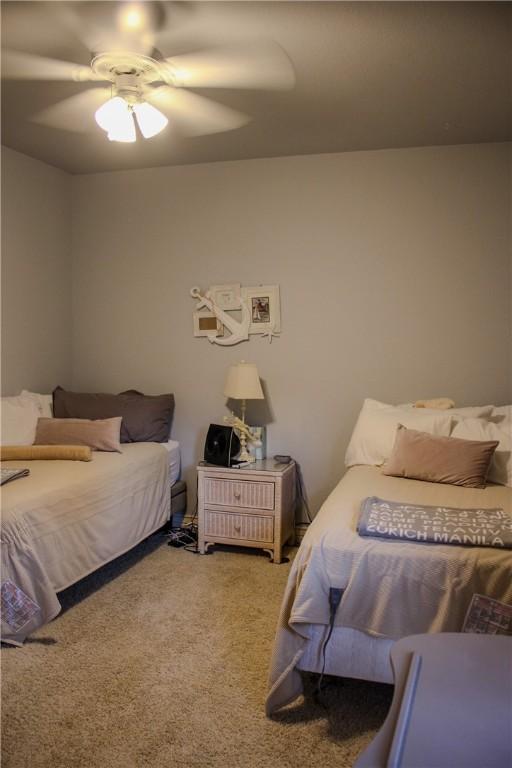 carpeted bedroom with ceiling fan