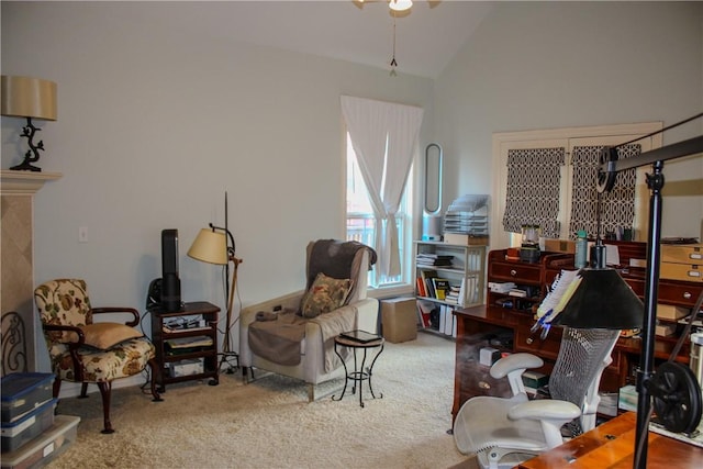 sitting room featuring carpet floors and lofted ceiling