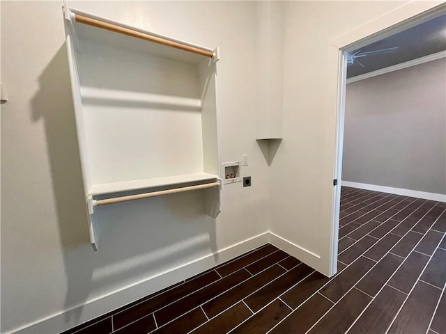 spacious closet with dark hardwood / wood-style flooring