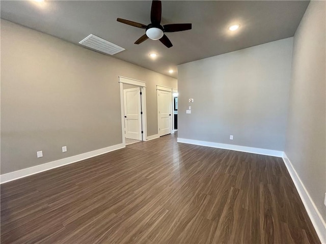 unfurnished room with dark hardwood / wood-style floors and ceiling fan