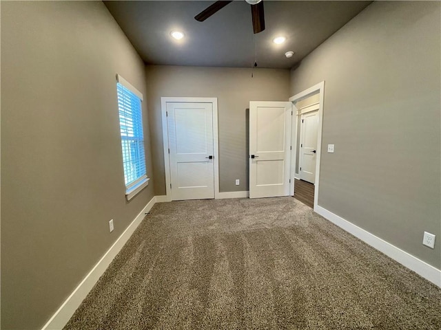 unfurnished bedroom with carpet and ceiling fan