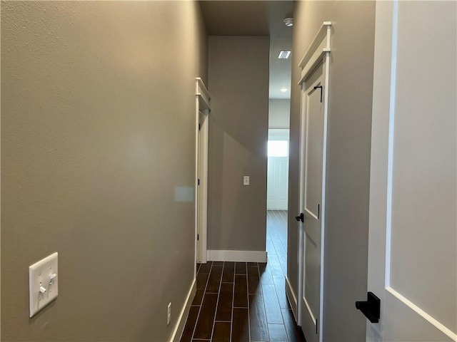 hall with dark hardwood / wood-style flooring