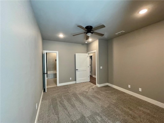 unfurnished bedroom with carpet floors and ceiling fan