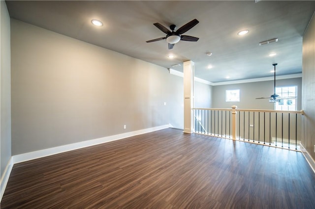 empty room with dark hardwood / wood-style floors, ceiling fan, and crown molding