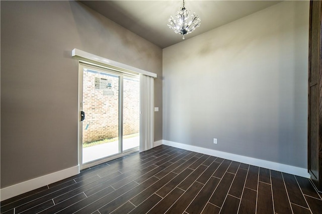 unfurnished room with an inviting chandelier