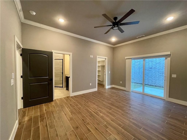 unfurnished room with ceiling fan, crown molding, and dark wood-type flooring