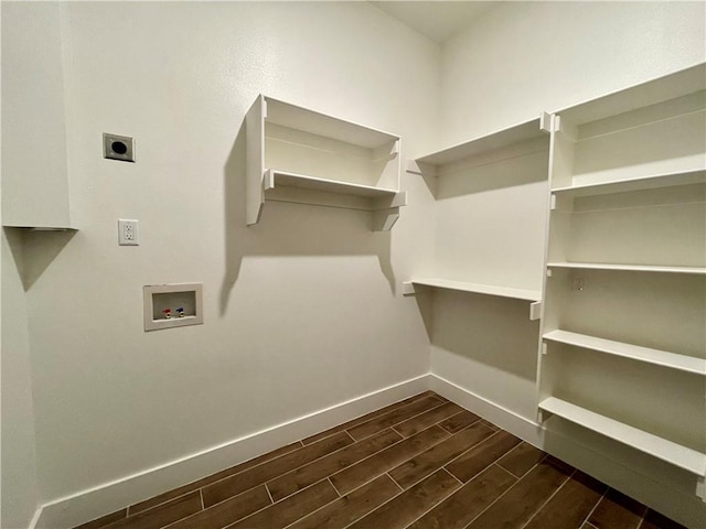 laundry room with hookup for an electric dryer, dark hardwood / wood-style floors, and hookup for a washing machine