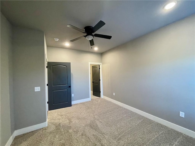 unfurnished bedroom with carpet flooring and ceiling fan