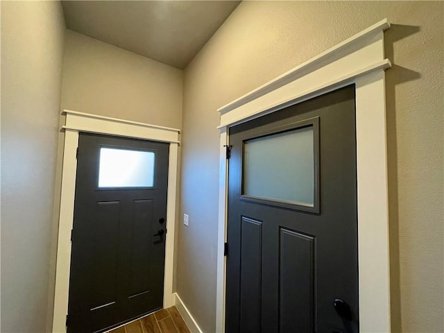 foyer with dark hardwood / wood-style flooring