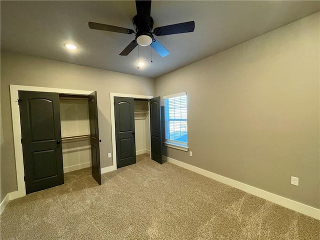 unfurnished bedroom featuring carpet and ceiling fan