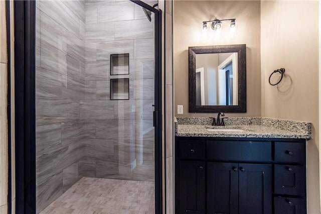 bathroom featuring vanity and walk in shower