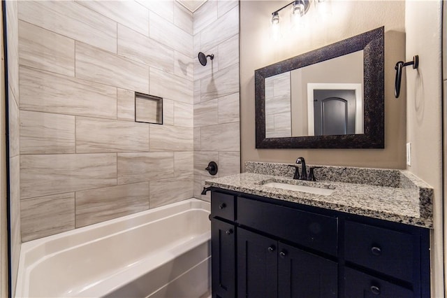 bathroom featuring vanity and tiled shower / bath combo