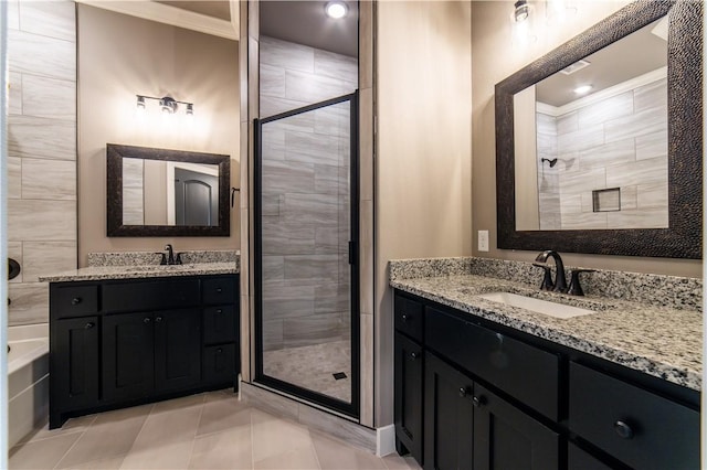 bathroom featuring tile patterned floors, a shower with door, vanity, and ornamental molding