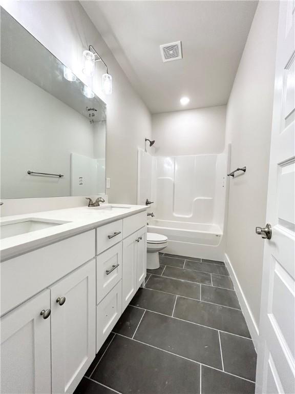 full bathroom with toilet, vanity, bathing tub / shower combination, and tile patterned floors