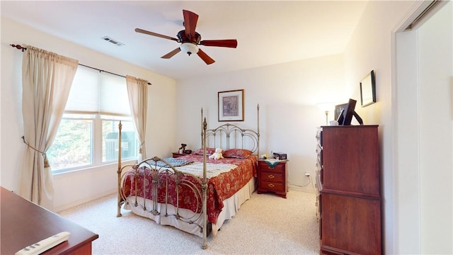 bedroom featuring light colored carpet and ceiling fan