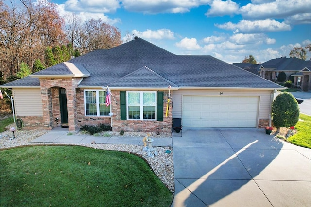 view of front of house featuring a front lawn and a garage