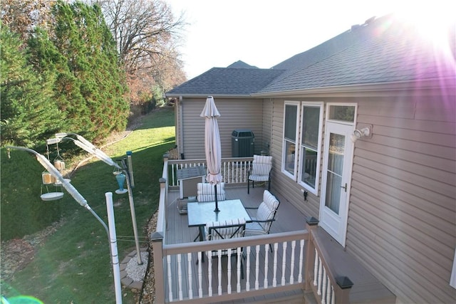 wooden deck with a lawn