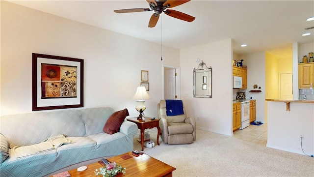 living room featuring ceiling fan and light carpet